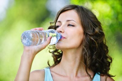 Healthy lifestyle - woman drinking water