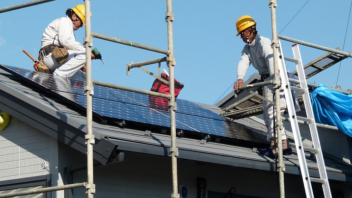 Solar panels being installed on roof