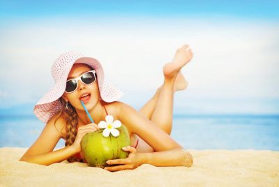 Coconut water drinking on the beach